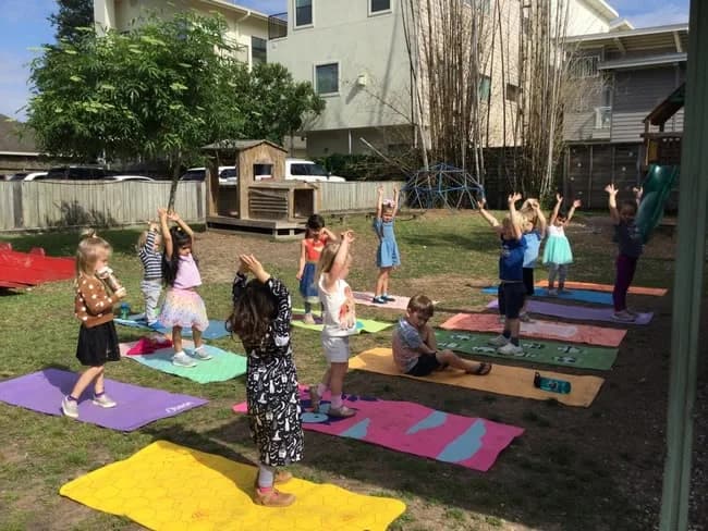 Children doing outdoor yoga