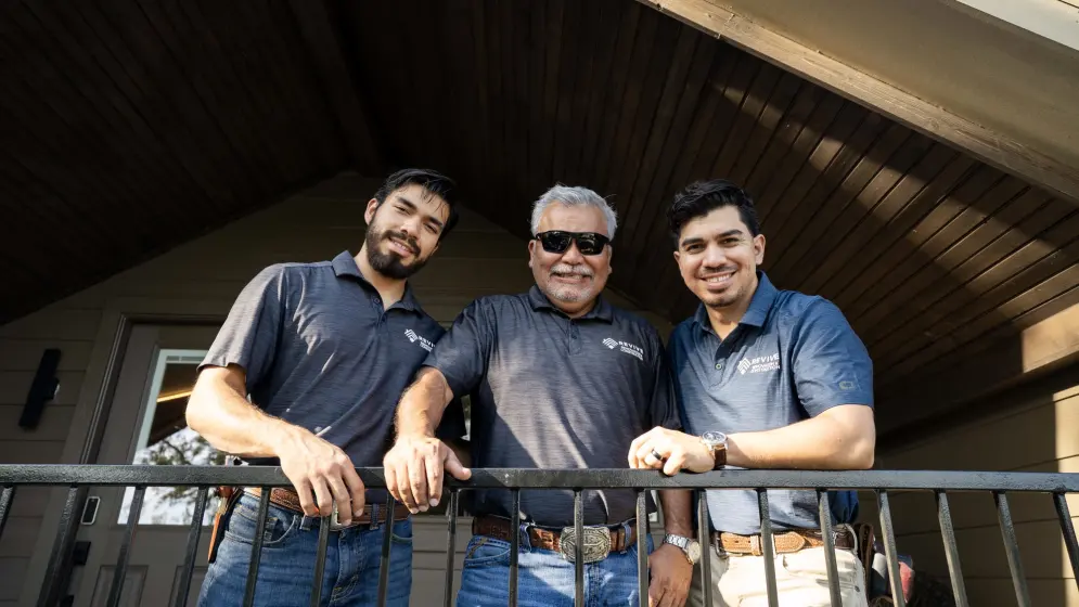 The Revive team standing together on a porch